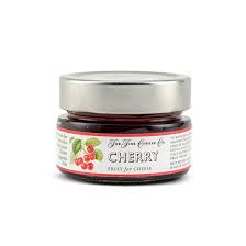 Cherry jam in glass jar with label
