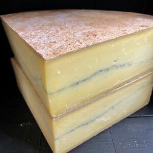 Stacked slices of aged blue cheese