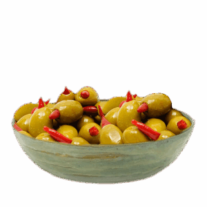 Bowl of green olives stuffed with red peppers
