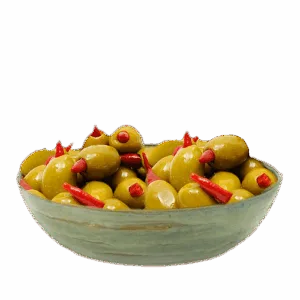 Bowl of green olives stuffed with red peppers