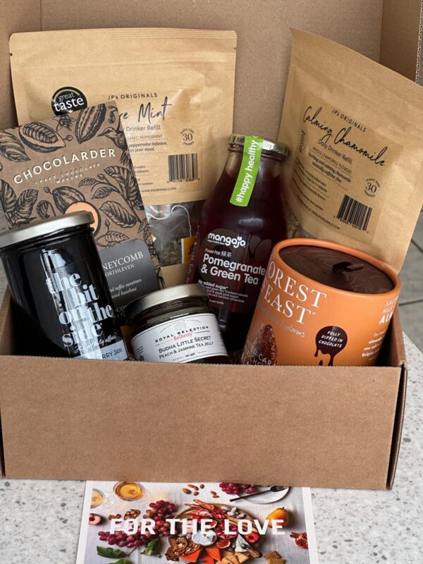 Assorted gourmet food and drink items in a box