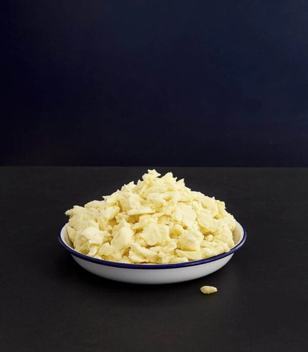 Bowl of scrambled eggs on dark background