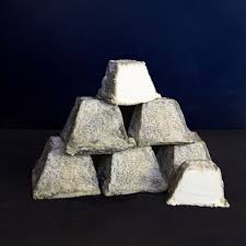 Stacked pyramid of traditional white Valençay cheese