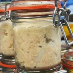 Glass jars with sealed lids containing homemade lard