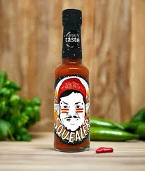 Squealers hot sauce bottle on wooden surface