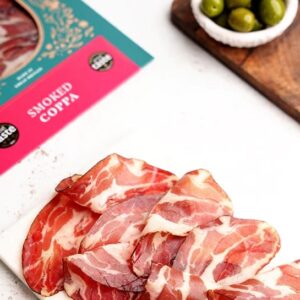Sliced smoked coppa with olives and packaging