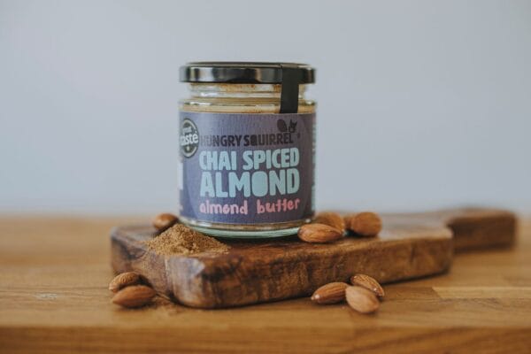 Chai spiced almond butter jar on wooden board