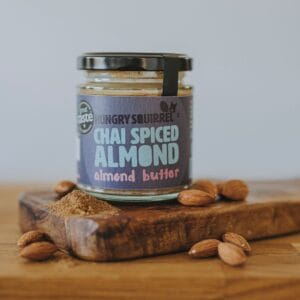 Chai Spiced Almond Butter jar on wooden board
