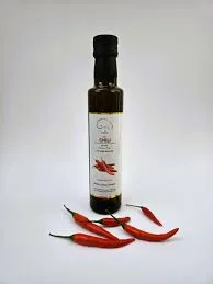 Chilli-infused olive oil bottle with red peppers