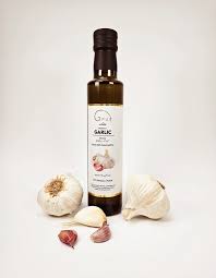 Garlic infused oil bottle with whole garlic bulbs