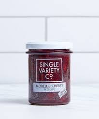 Jar of Morello Cherry Preserve on white backdrop