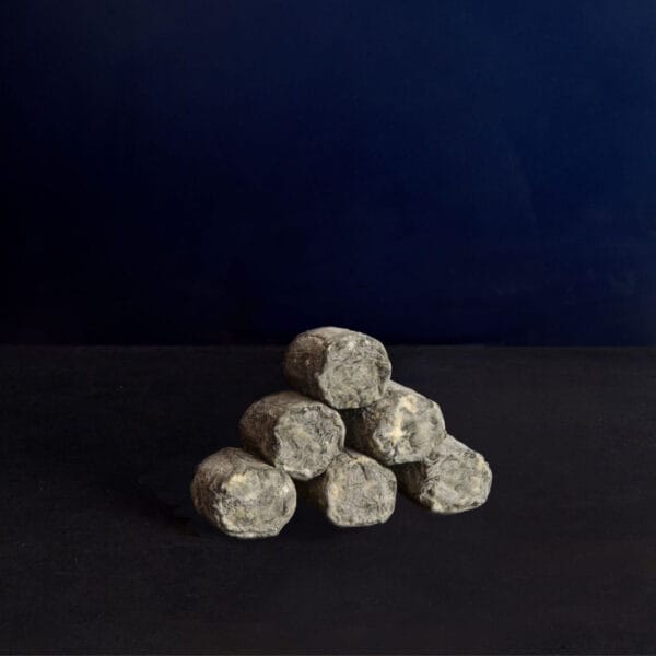 Pile of grey rocks on dark background