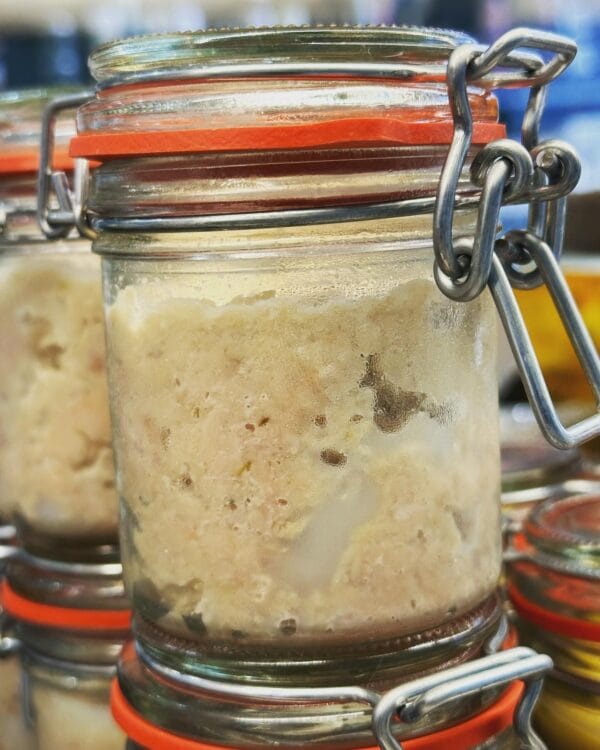 Close-up of potted meat in glass jar with clamp lid