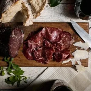 Rustic charcuterie board with cured meats and bread