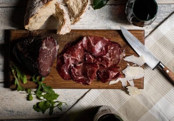 Rustic charcuterie board with cured meats and bread