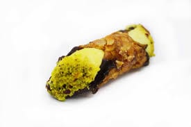 Pistachio cannoli with chocolate chips on white background