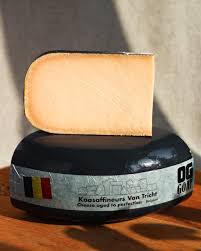 Aged Belgian cheese on wooden table