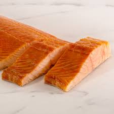 Fresh sliced salmon fillet on marble surface