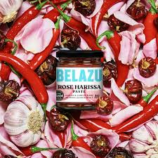 Belazu Rose Harissa paste jar surrounded by spices